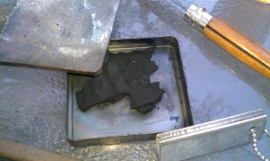 Used on old Camel cigarette tin to char the cotton.