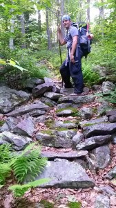 Brad stops for a photo on one a rocky slope that someone organized into stairs. This is rare on the Tuscarora. Most rocks are painful.