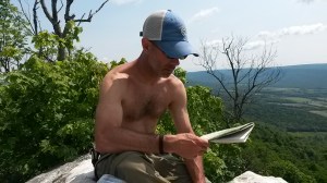 Checking the map at the vista on top of Knob Mountain. Photo/Josh Stadler