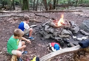 Carving sticks before dinner.